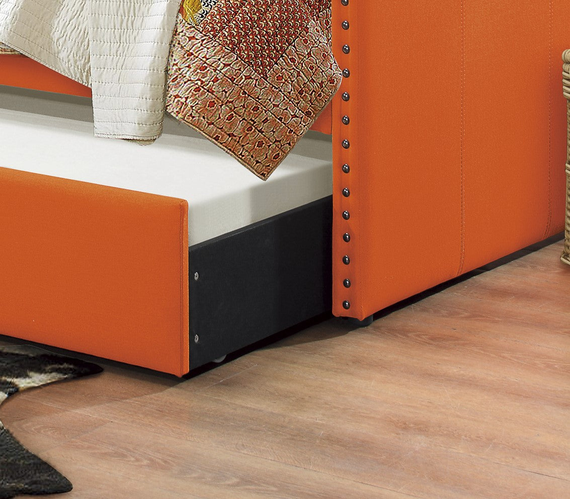 Orange upholstered twin bed frame with nailhead trim and pullout trundle