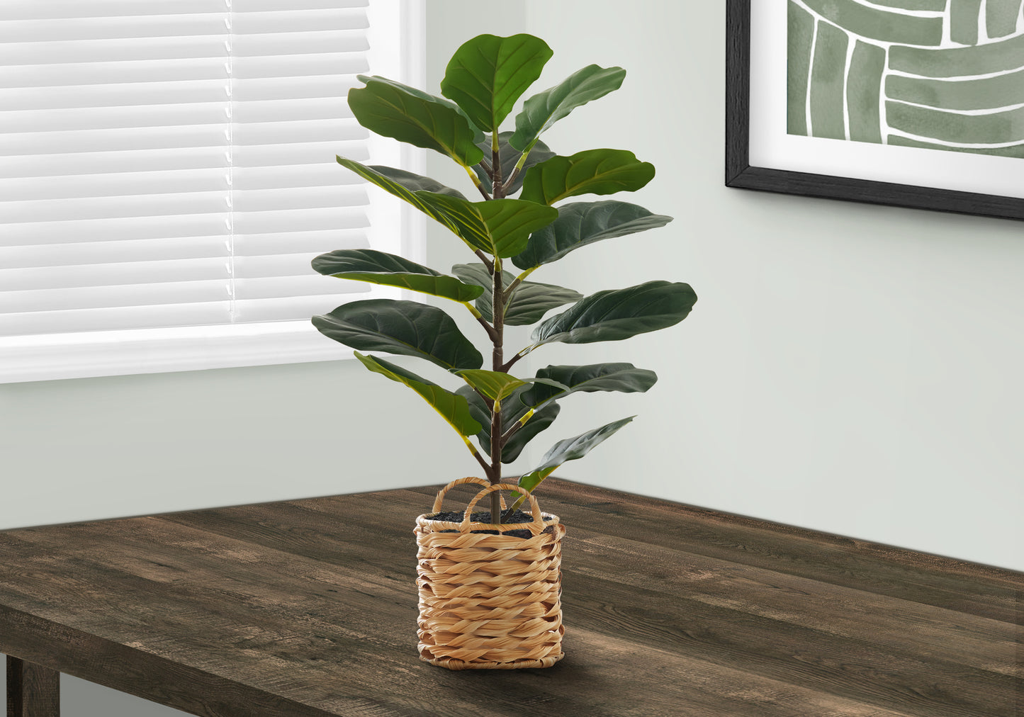 Fiddle leaf fig artificial plant with dark green leaves in woven basket planter