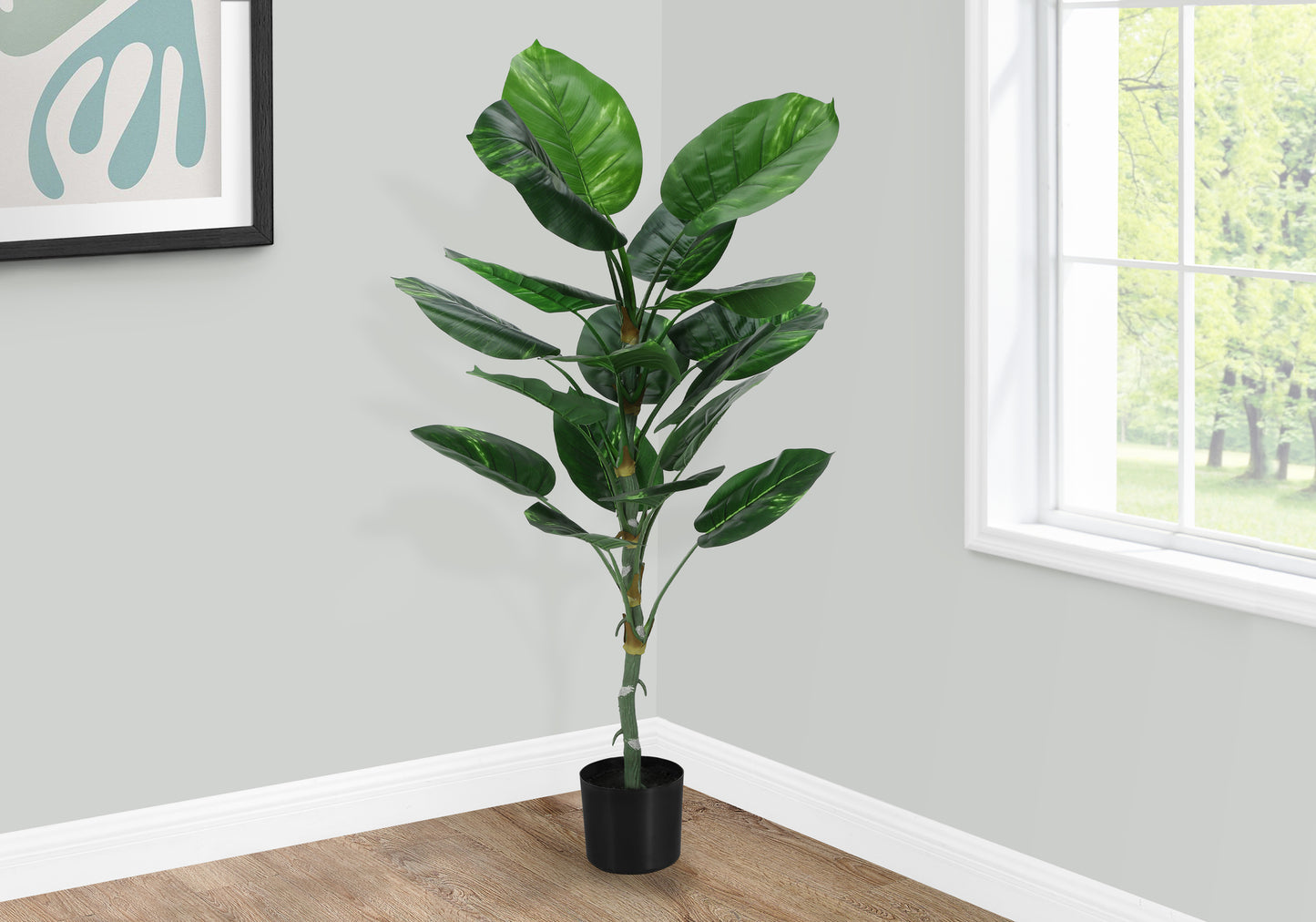 Tall artificial rubber plant with glossy green leaves in a black planter adding modern decor