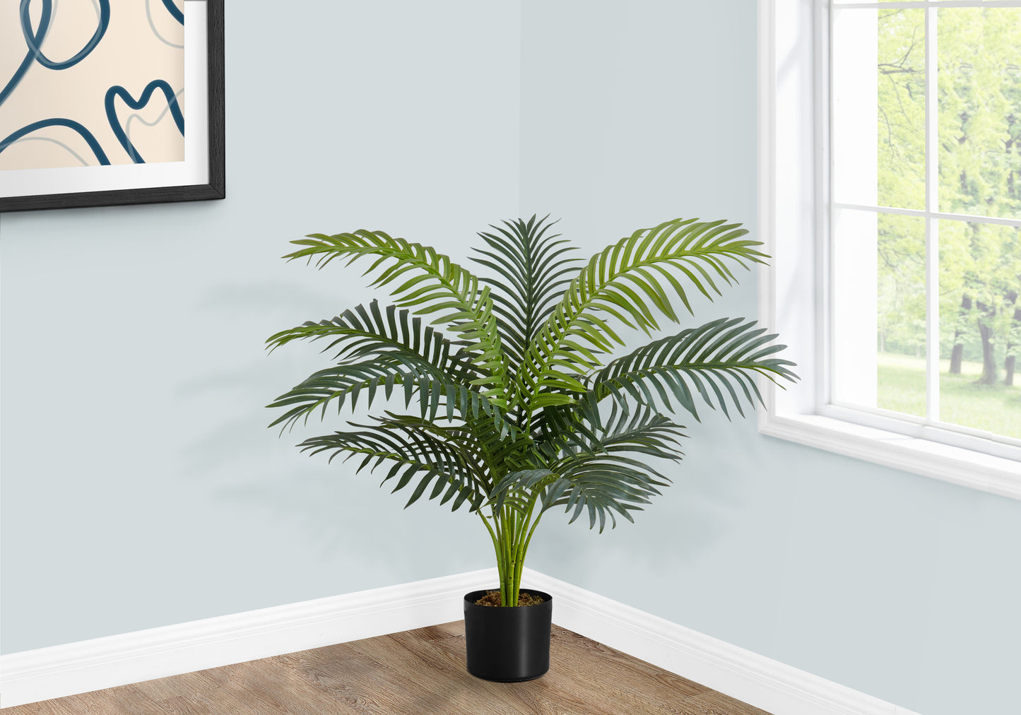 Realistic artificial Areca palm plant in a modern black pot for home decor