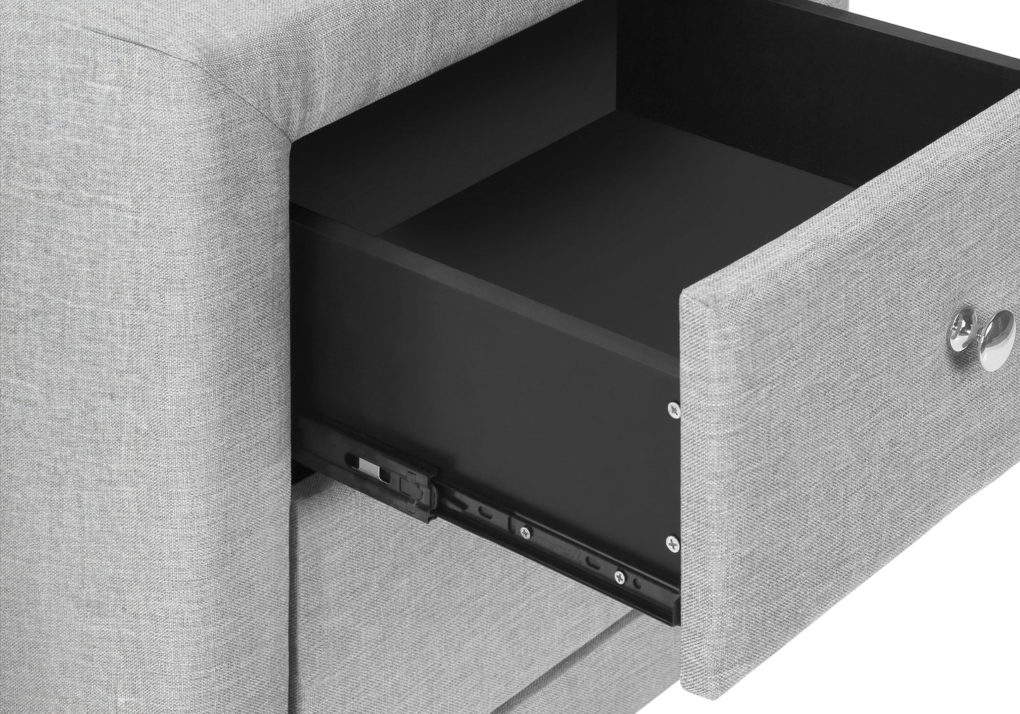 Light grey upholstered nightstand with one open black drawer and silver knob