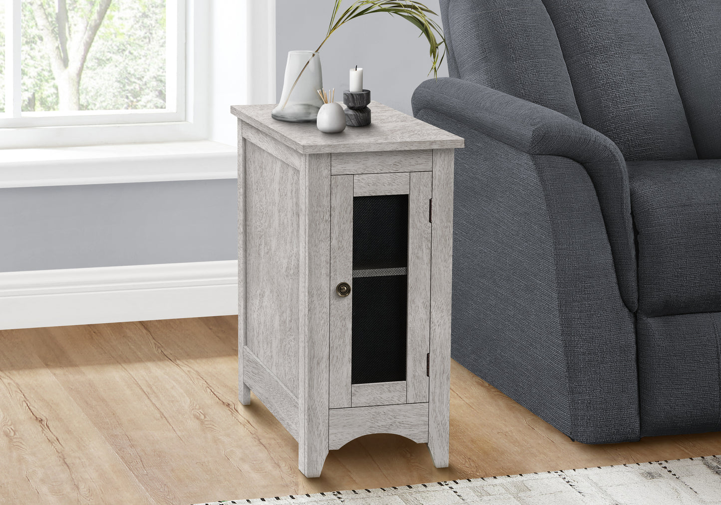 Distressed white wood accent cabinet with a glass door and brushed nickel knob