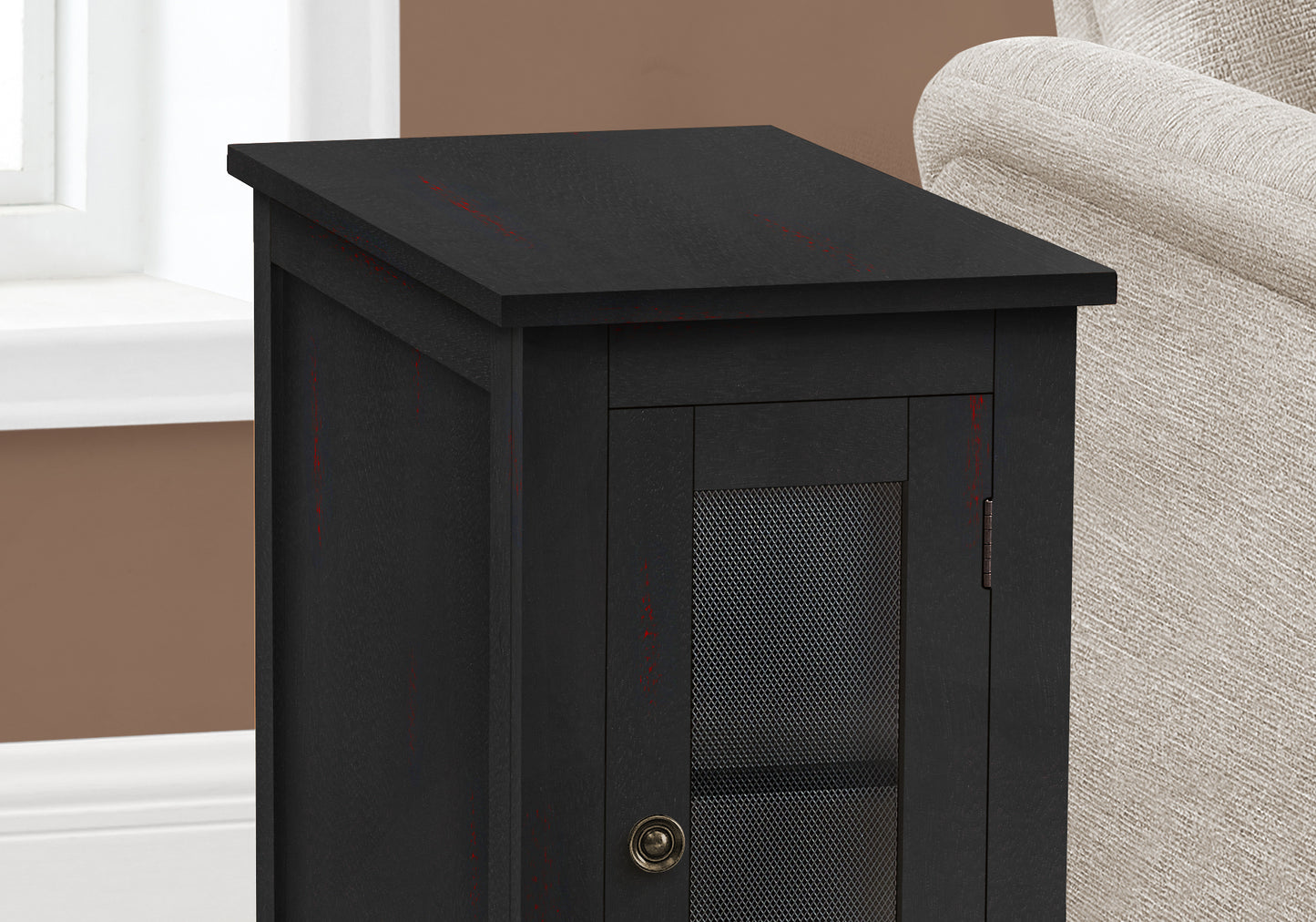 Black distressed wood end table with mesh door and antique knob