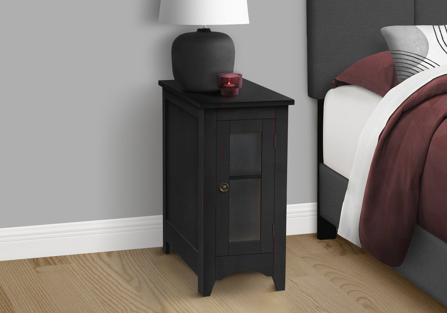 Black accent cabinet with metal mesh door and single drawer