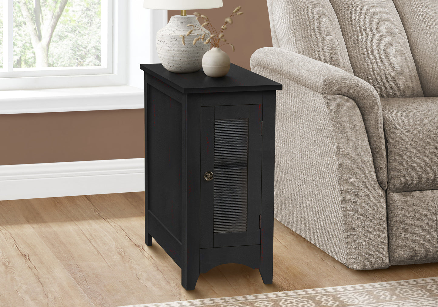 Black wood accent cabinet with mesh door and decorative accents ideal for small spaces