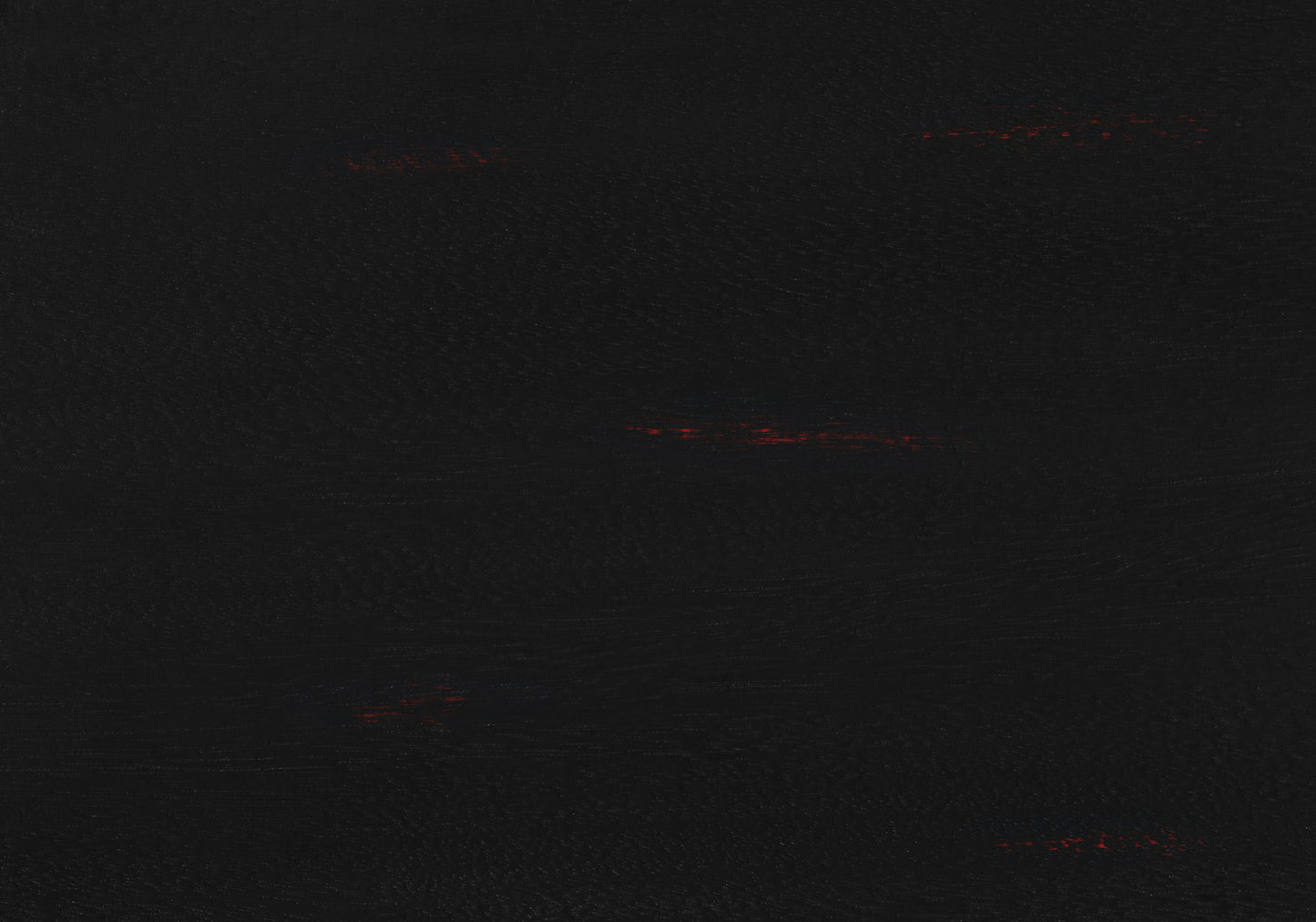 Textured black leather material with subtle red flecks for luxury handbag accents