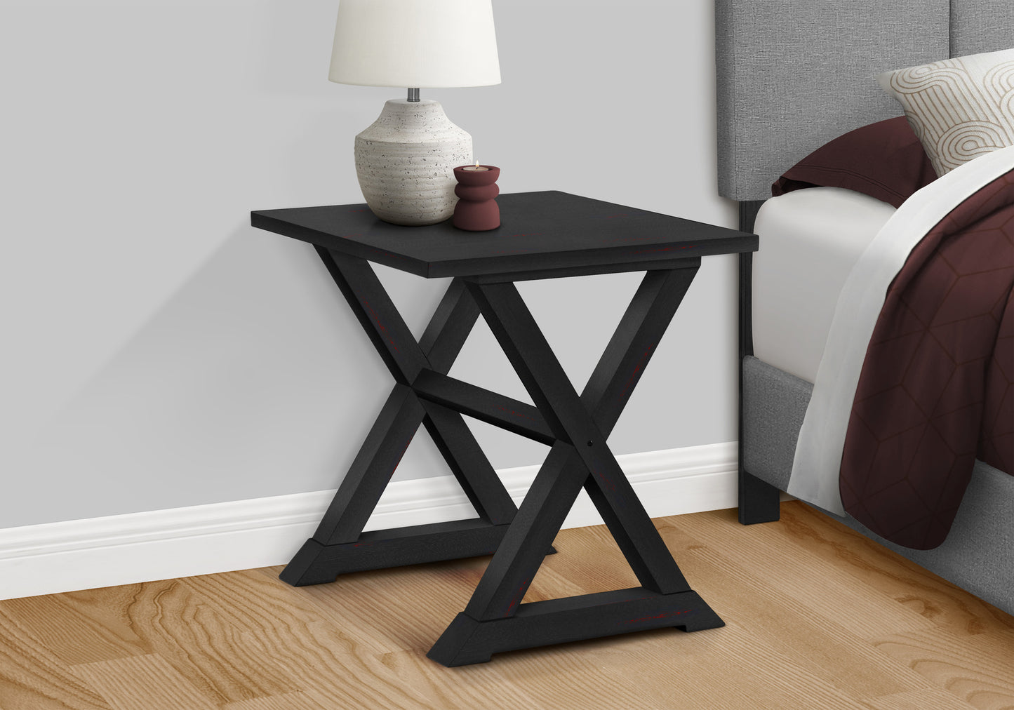 Black Xleg accent table with decorative red accents ideal for small spaces