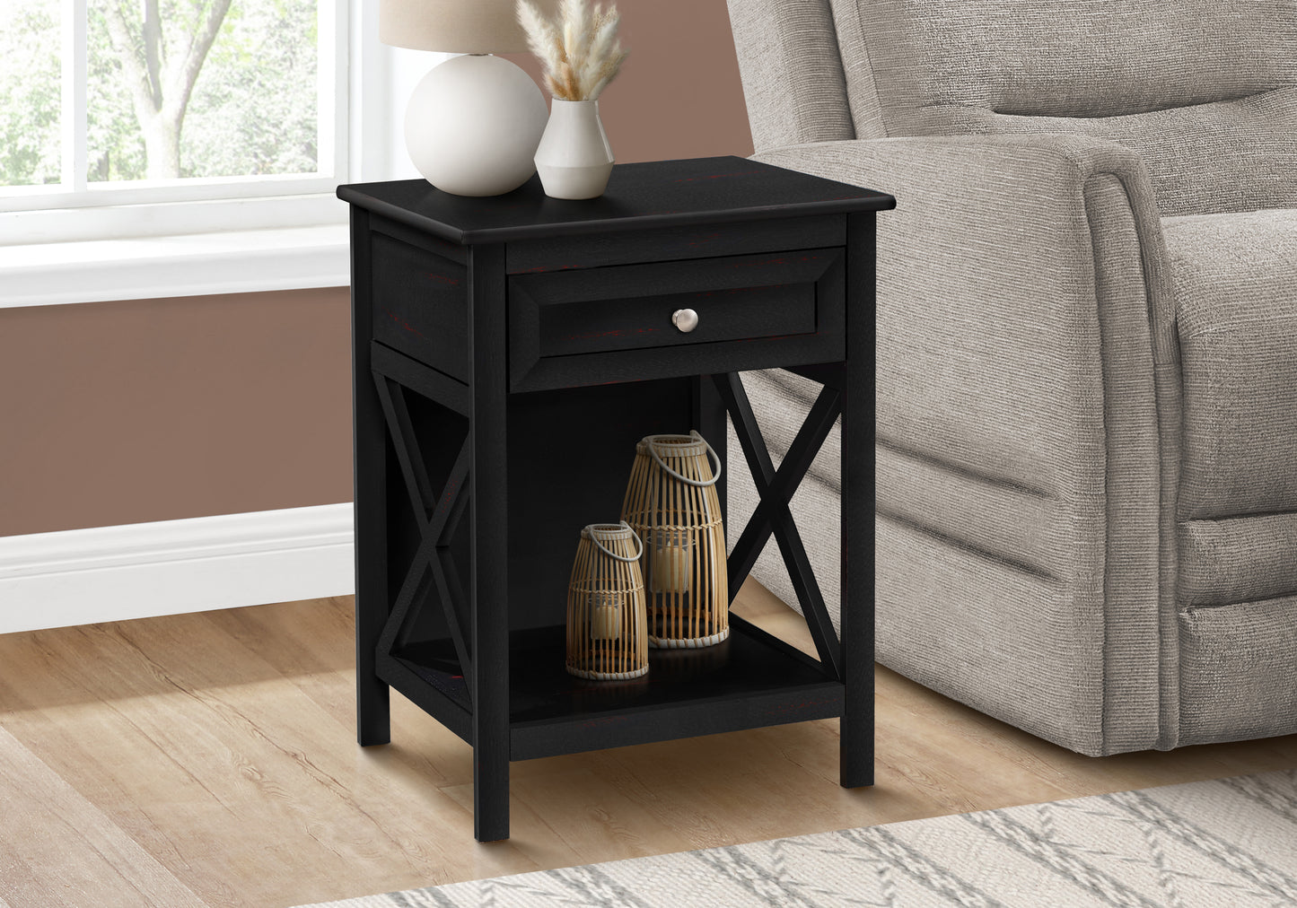Black wood end table with drawer and open shelf featuring crossleg design