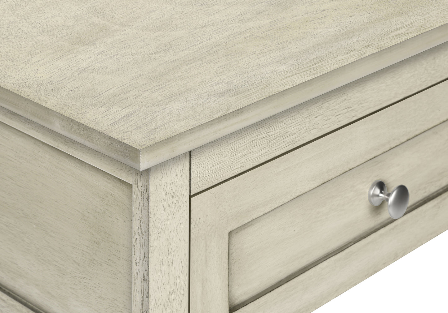 Whitewashed wood drawer with silver knob detail of a farmhouse dresser