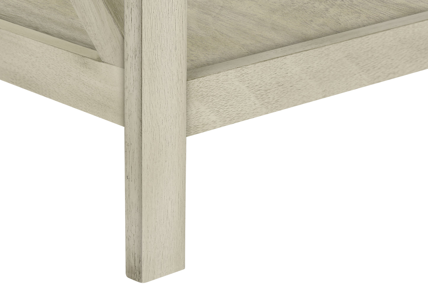 Closeup of distressed white wood table leg detail showing visible grain for rustic charm