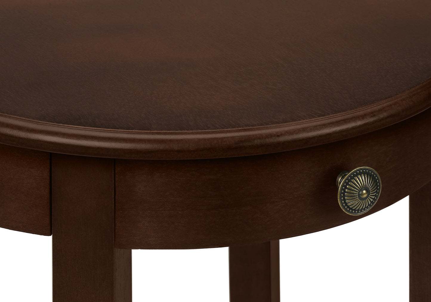 Dark wood oval accent table with ornate brass knob detail