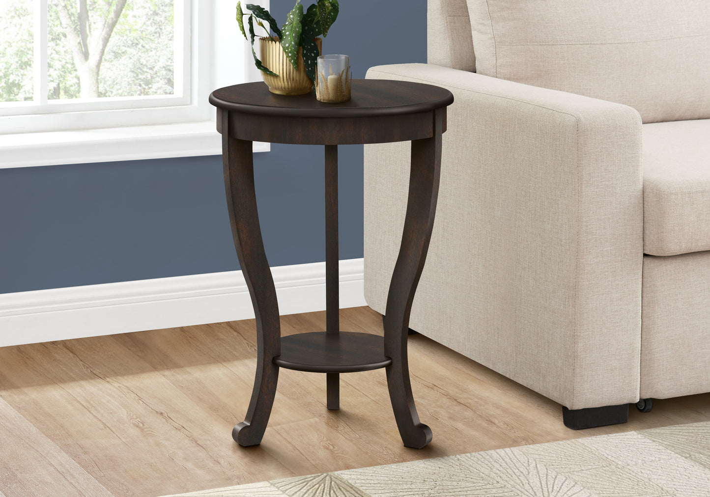 Dark wood round end table with curved legs and lower shelf perfect for living rooms