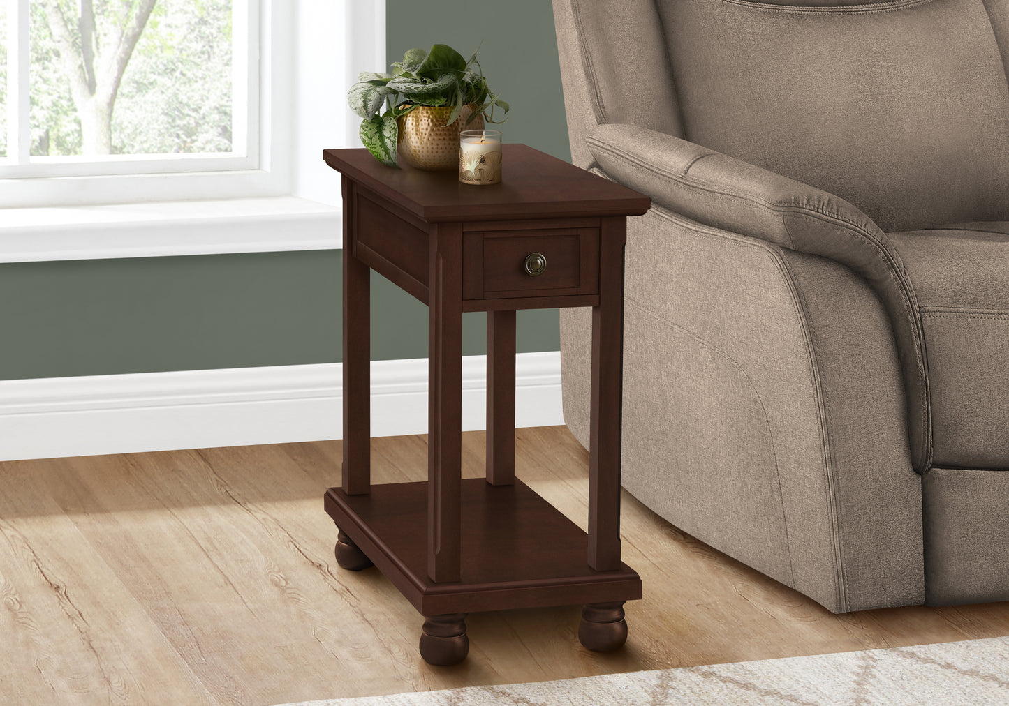 Dark brown wooden end table with one drawer and decorative knob beside a recliner