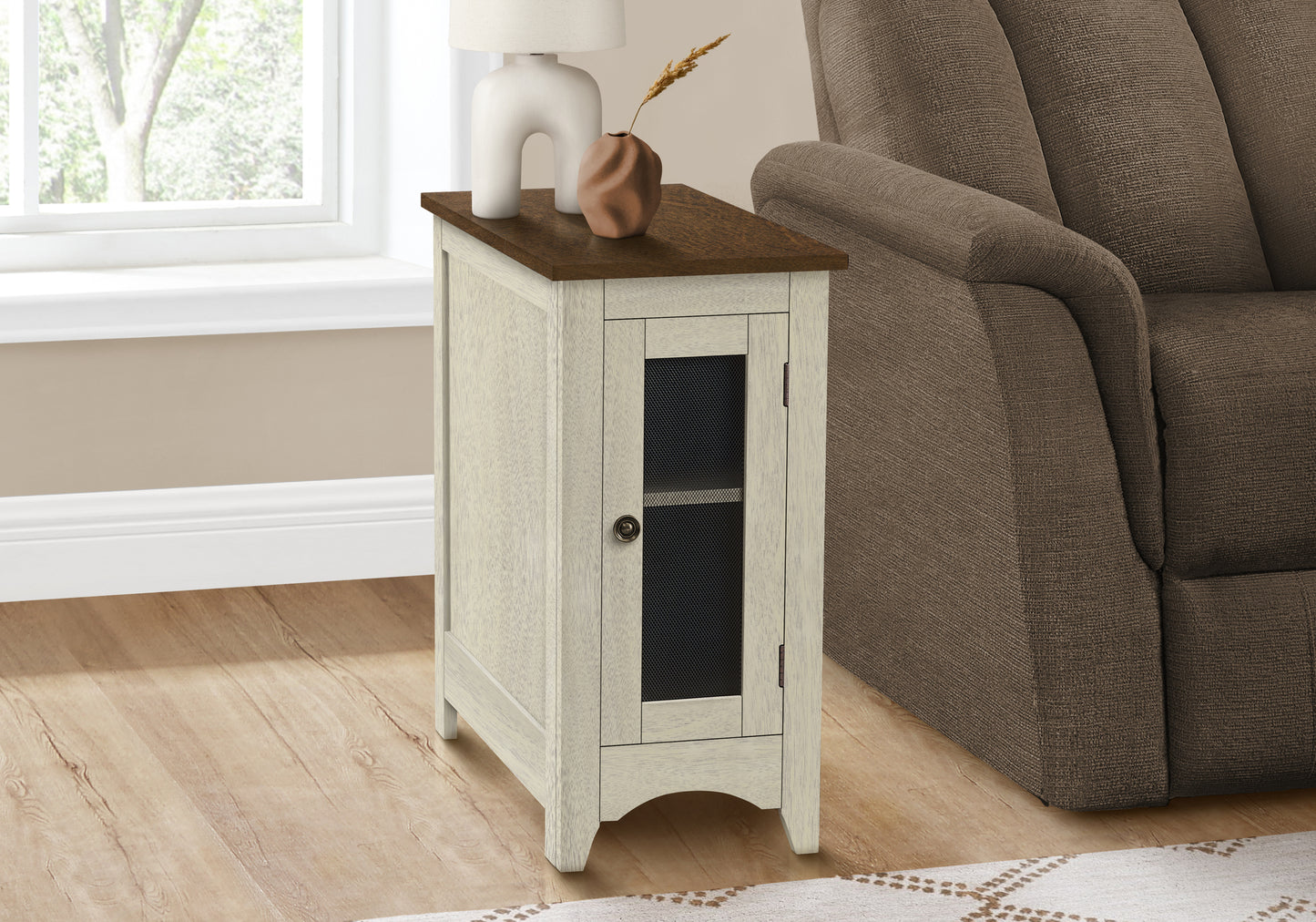 Distressed white accent cabinet with a dark wood top and wire mesh door