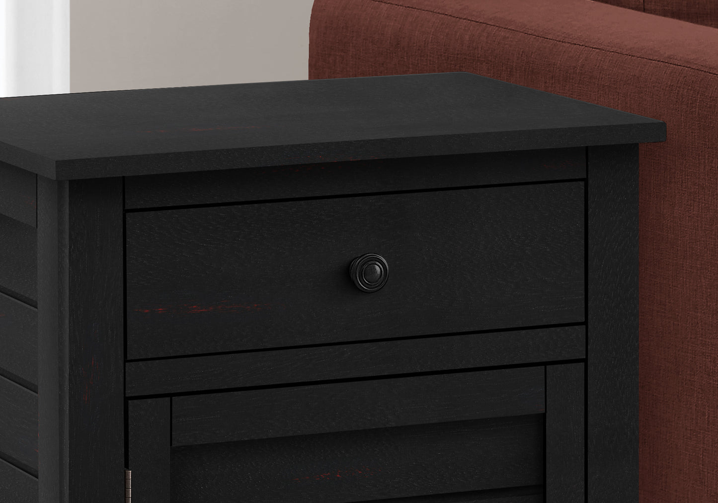Black distressed wood nightstand with a single drawer and cabinet