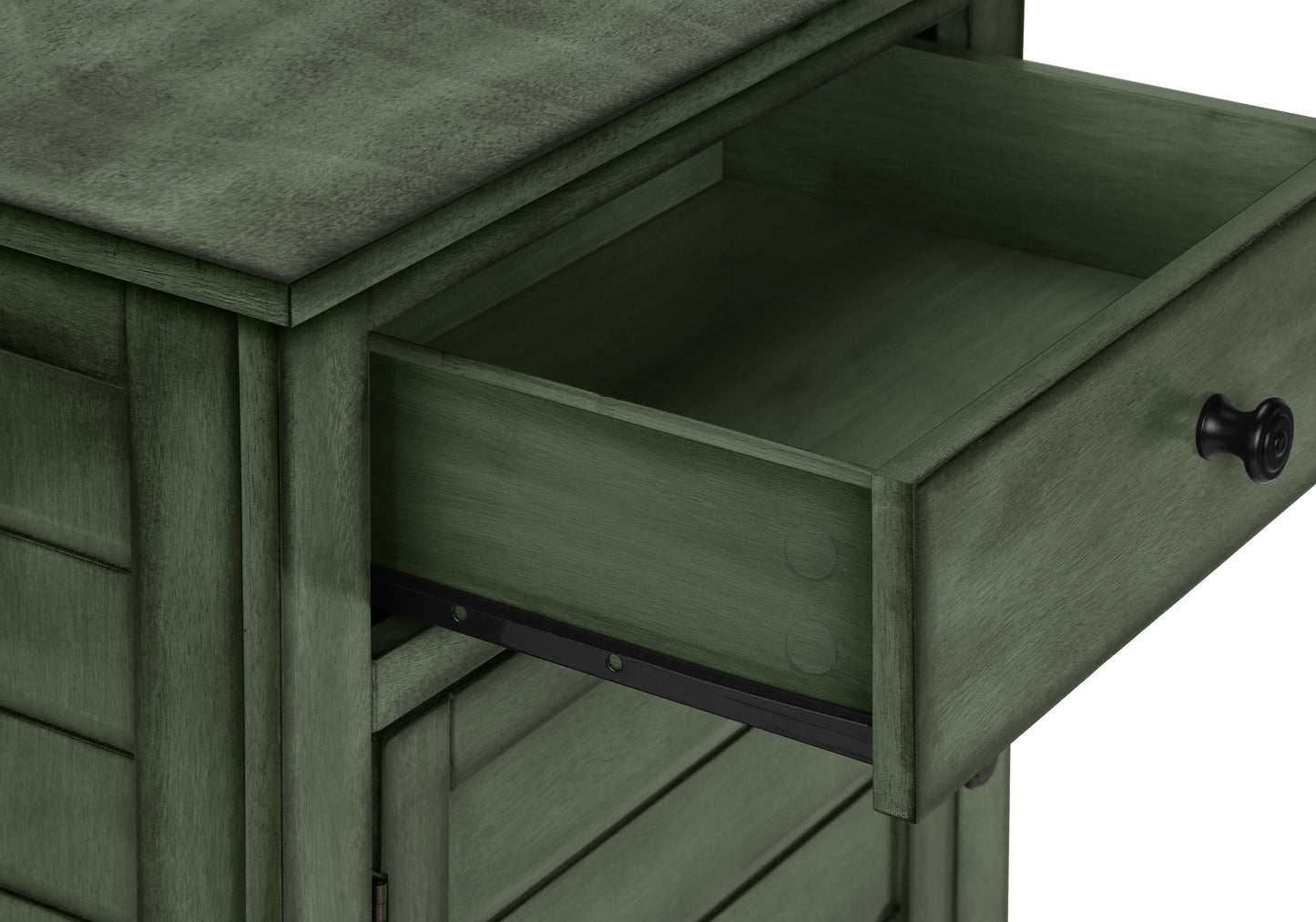 Green wooden cabinet with open drawer and black knob