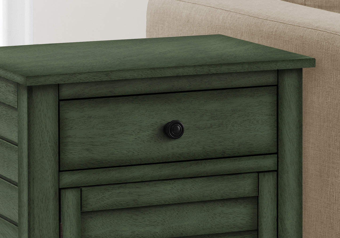 Dark green wood bedside table with one drawer and louvered door details
