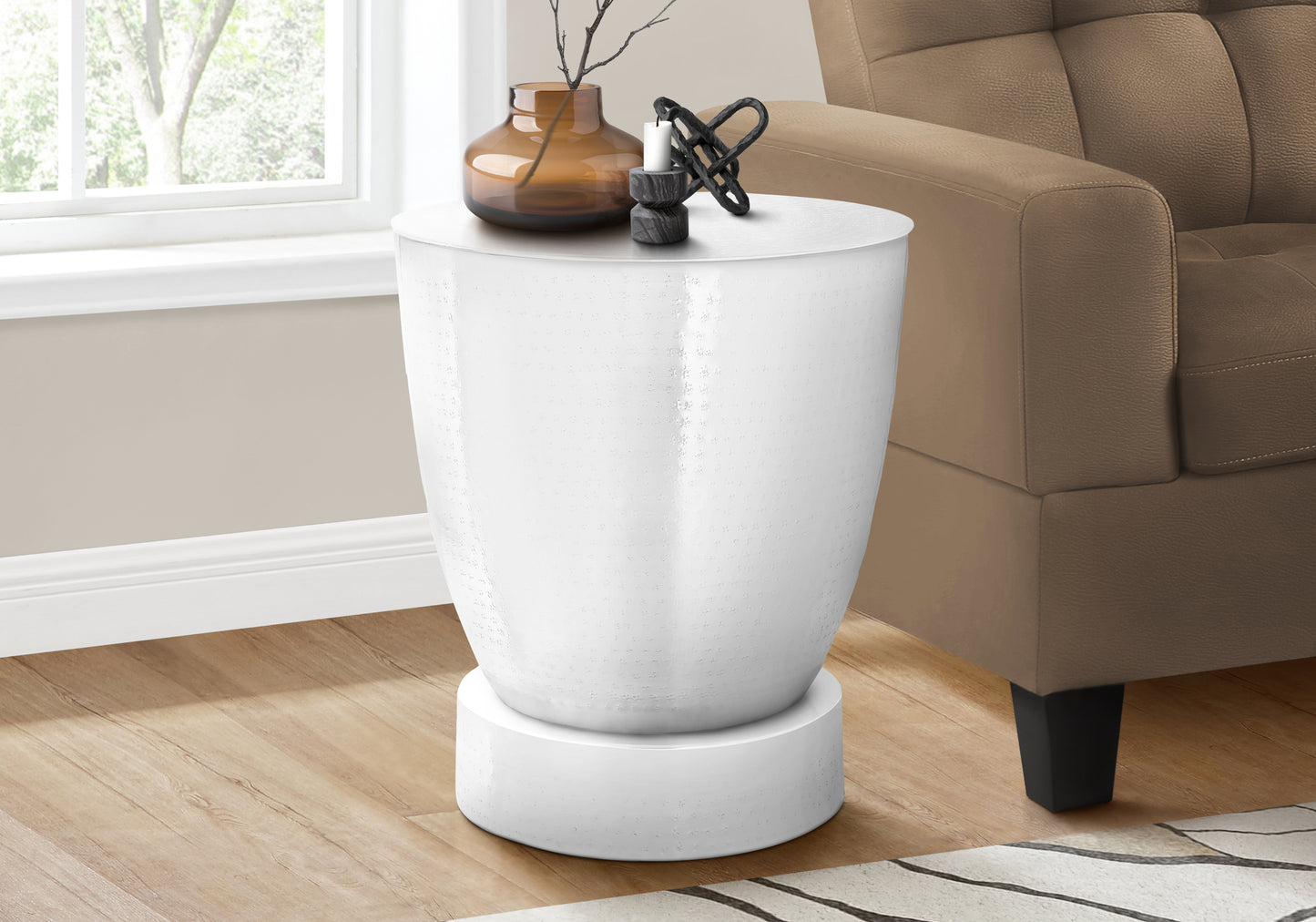 White metal drum accent table with textured surface and circular base