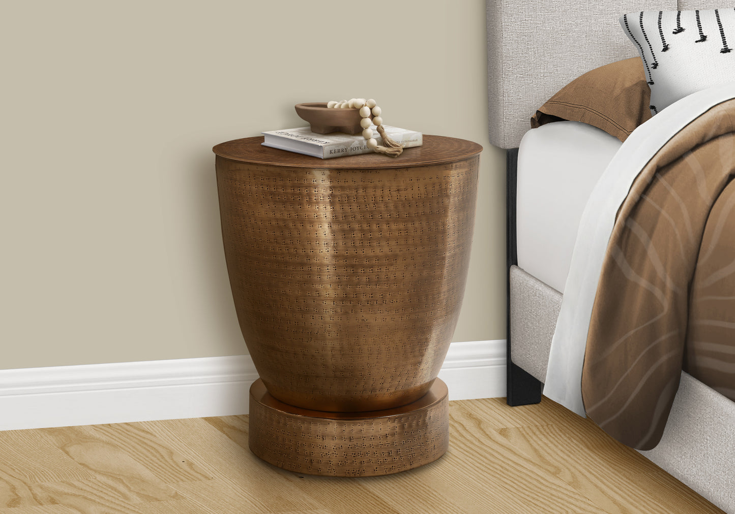 Textured bronze side table with a decorative perforated pattern and lid