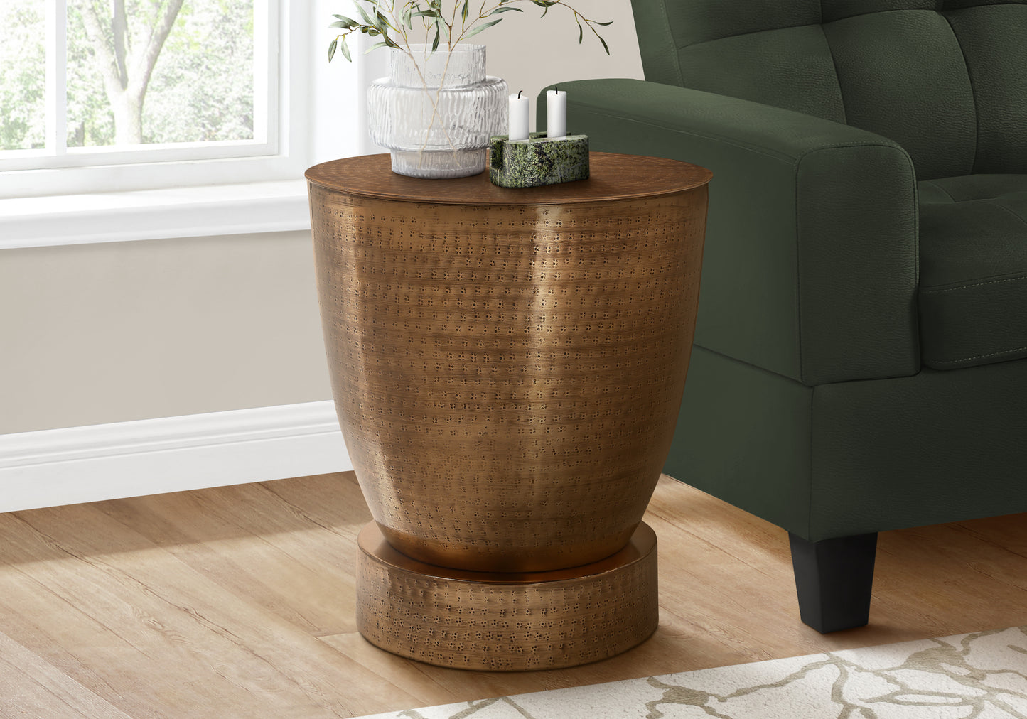 Antique brass side table with hammered metal texture and decorative perforations