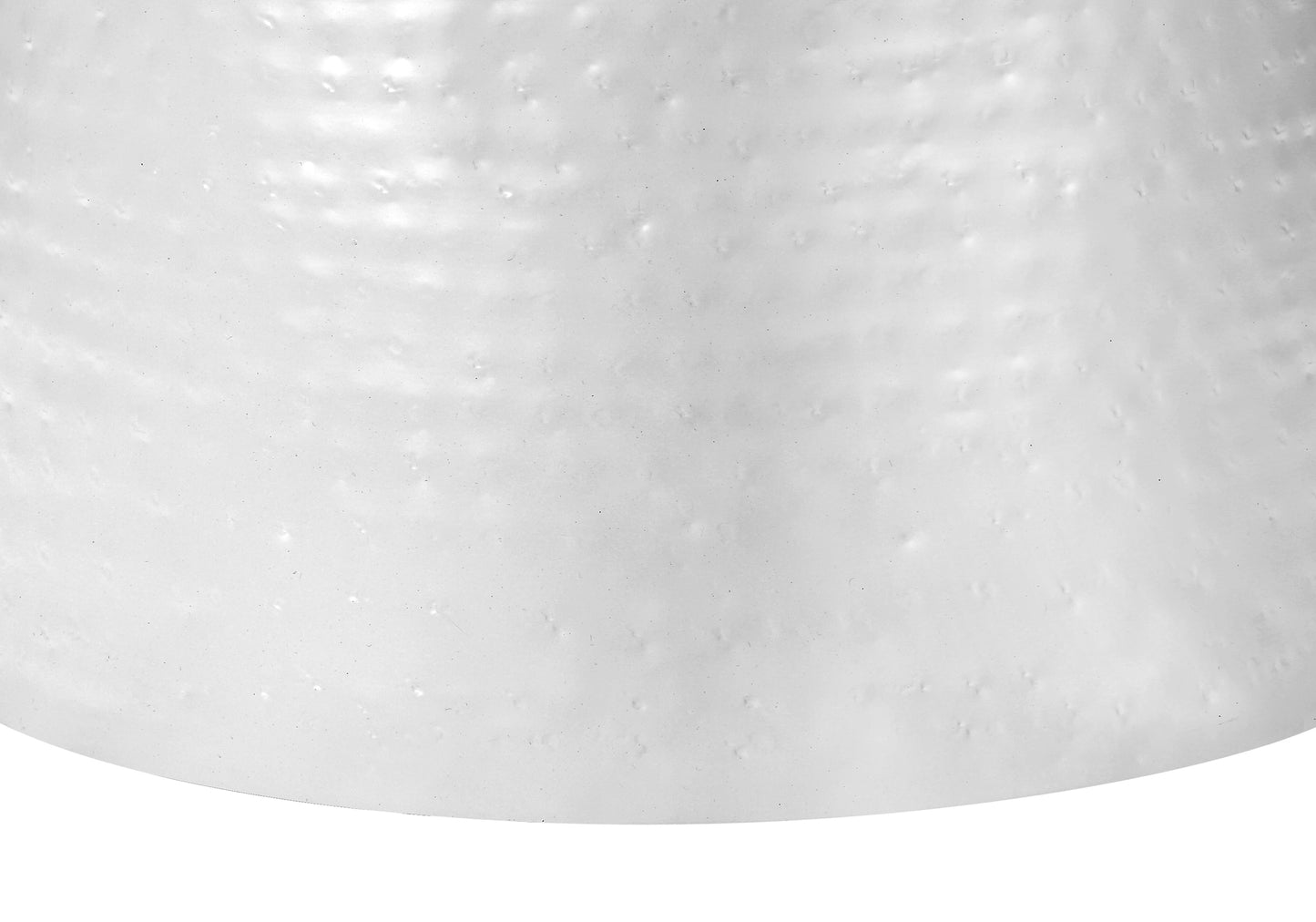 Closeup of textured white ceramic vase with subtle dimples