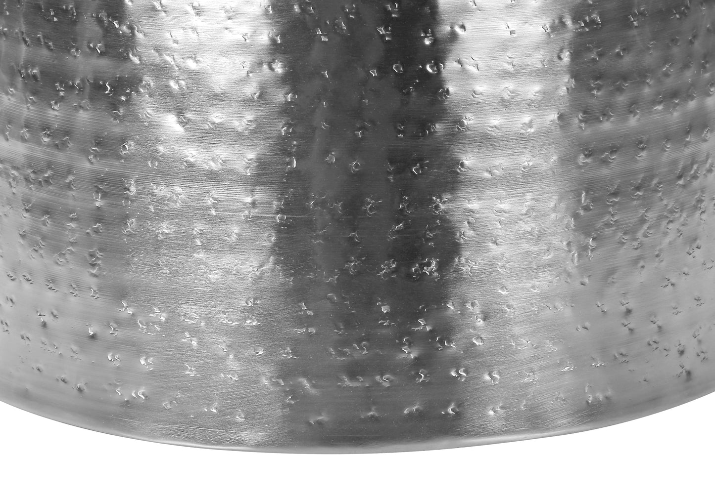 Textured silver metallic drum accent table with hammered finish