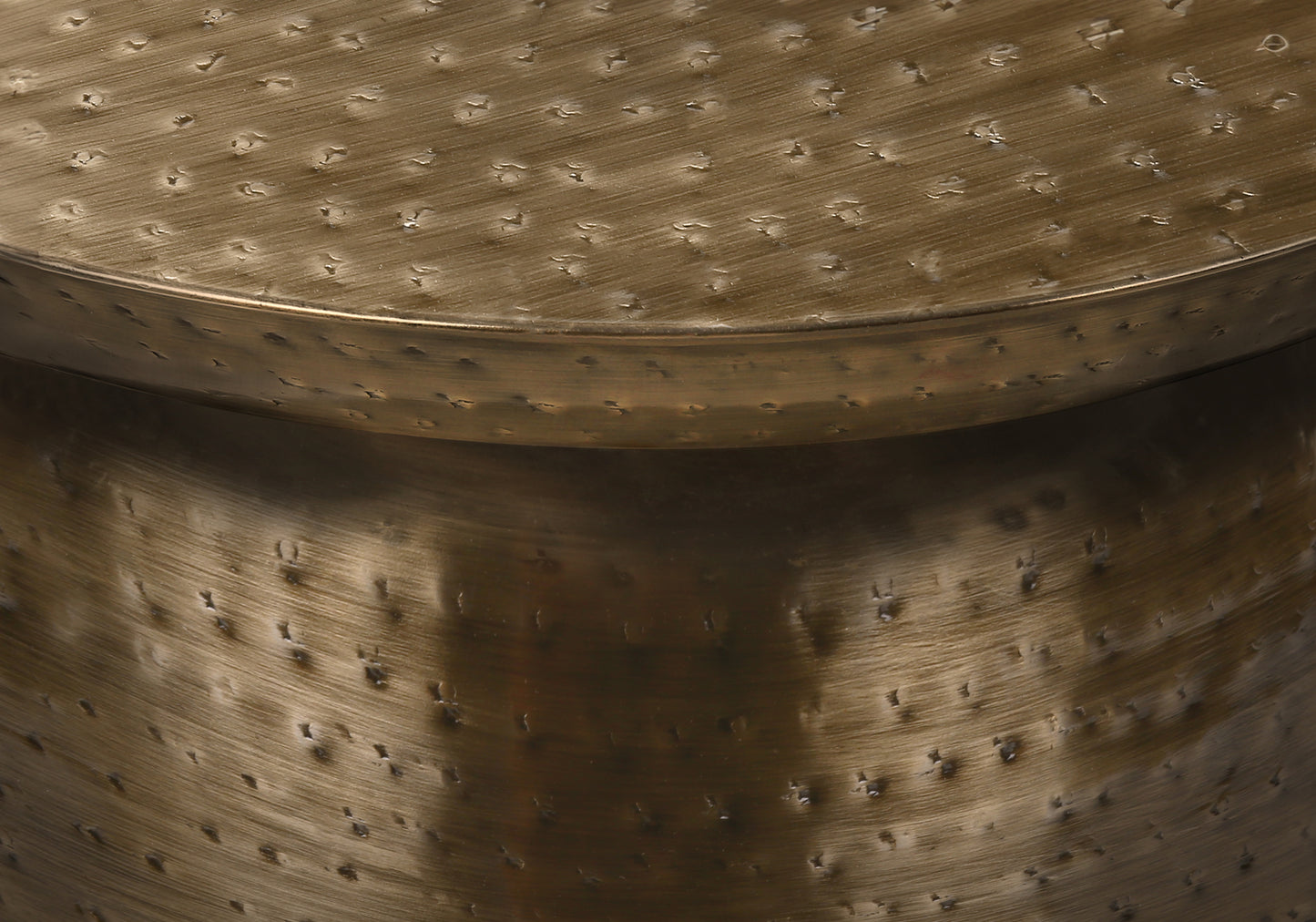 Antique brass hammered metal coffee table with textured surface