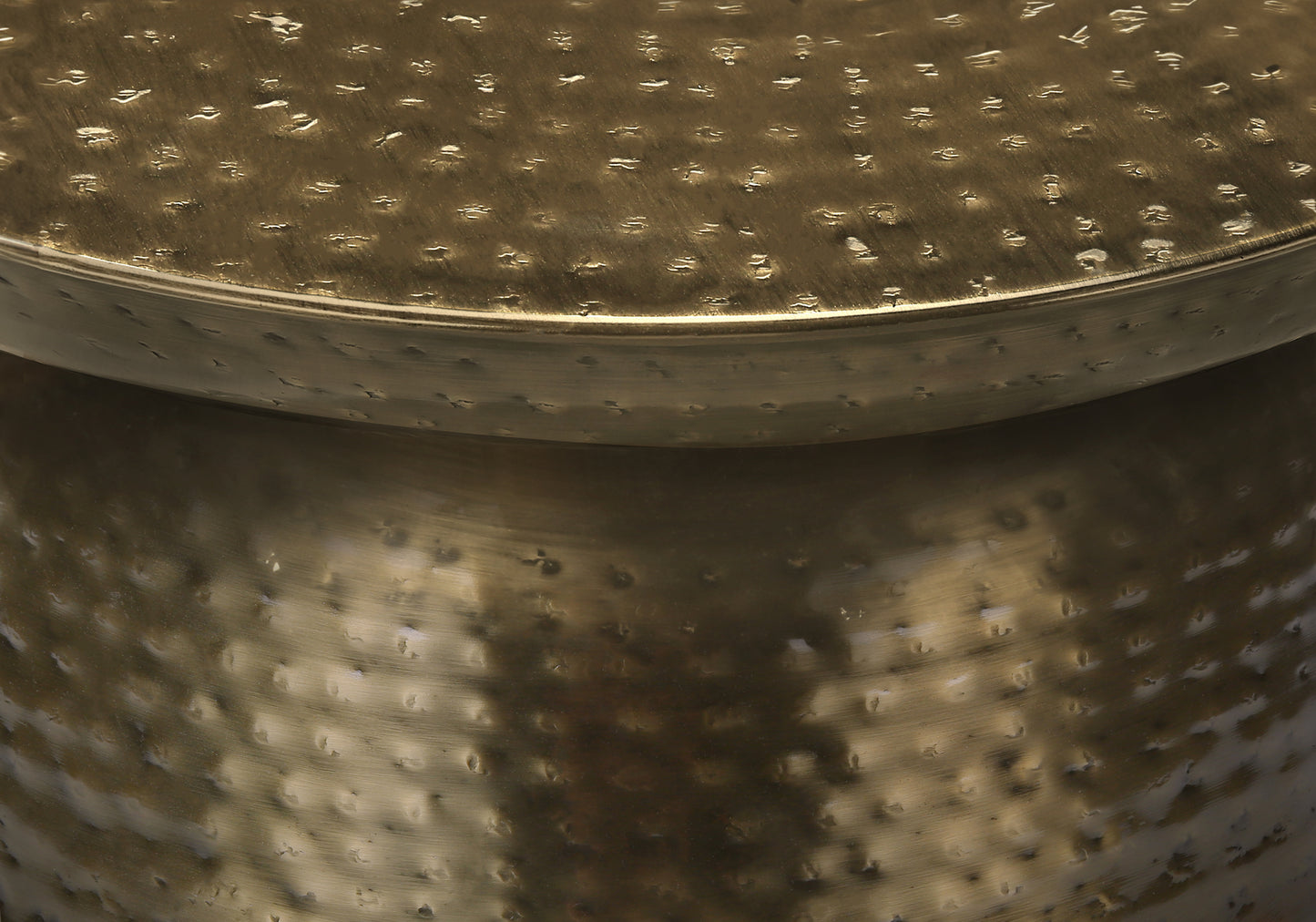 Hammered brass accent table with textured metallic finish ideal for living room decor