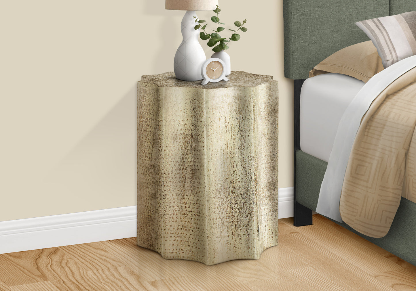Distressed gold textured side table with a scalloped base perfect for living room accents