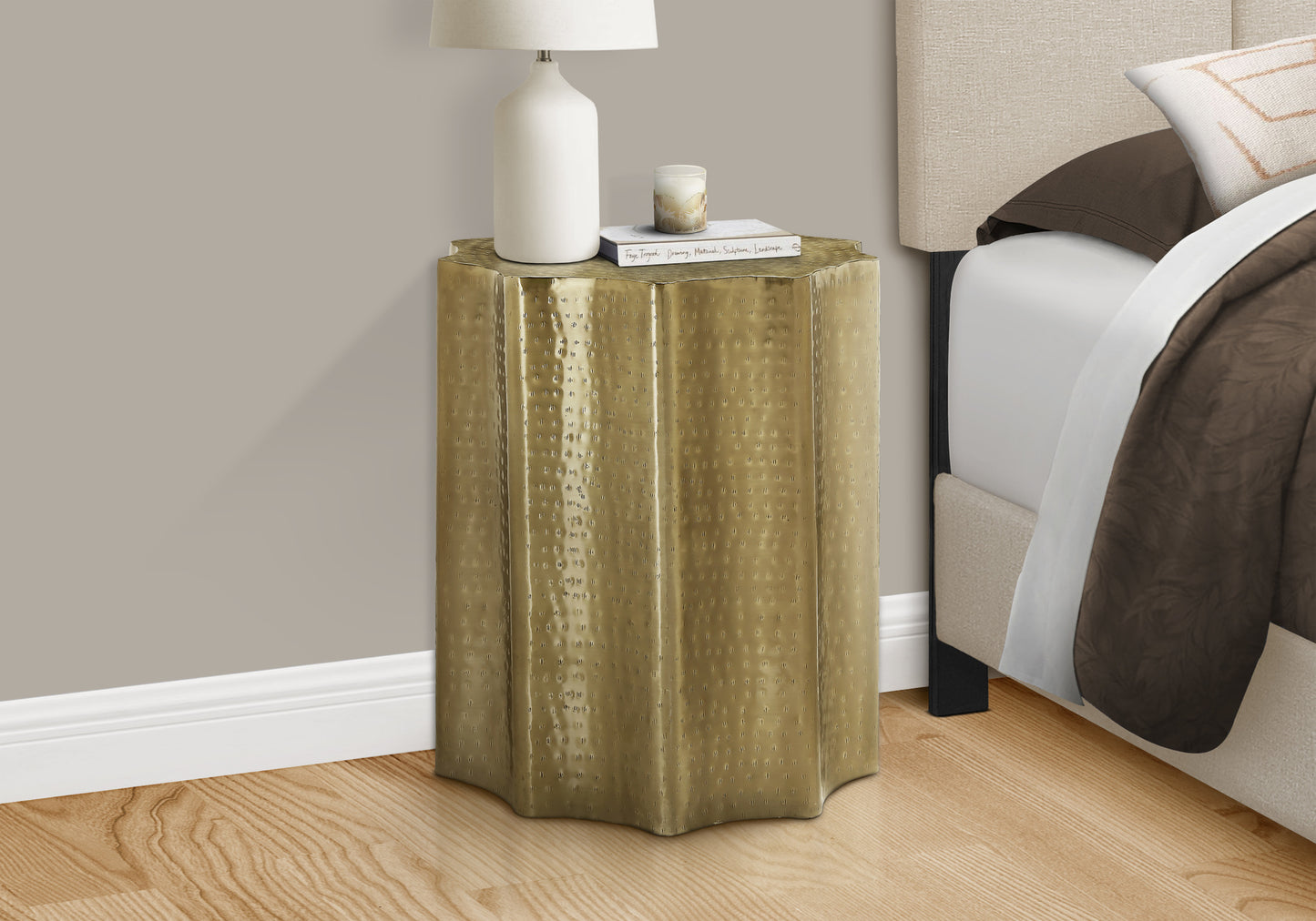 Hammered brass accent table with a textured finish perfect for modern living spaces