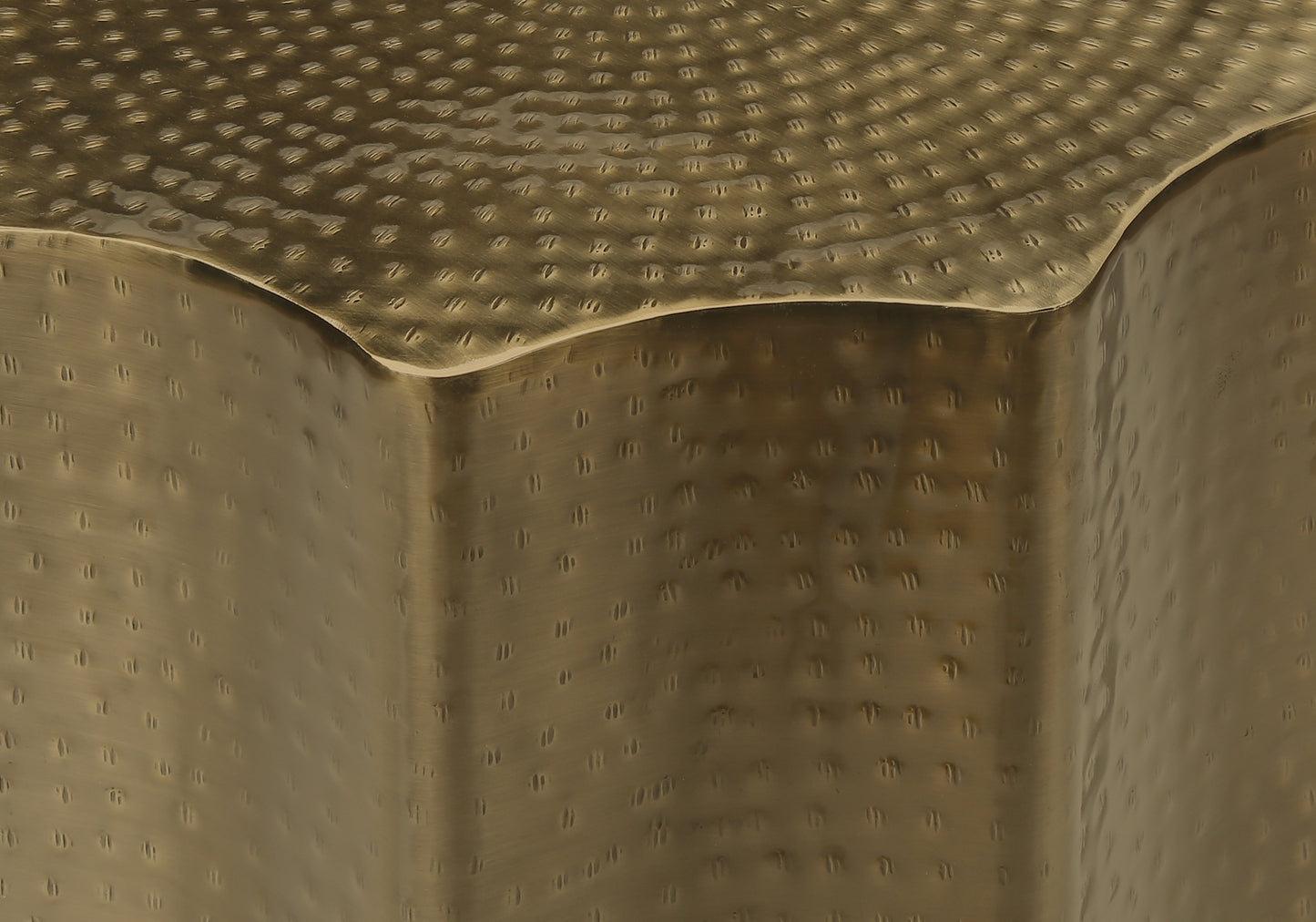 Hammered brass side table with an antique finish perfect for living room decor