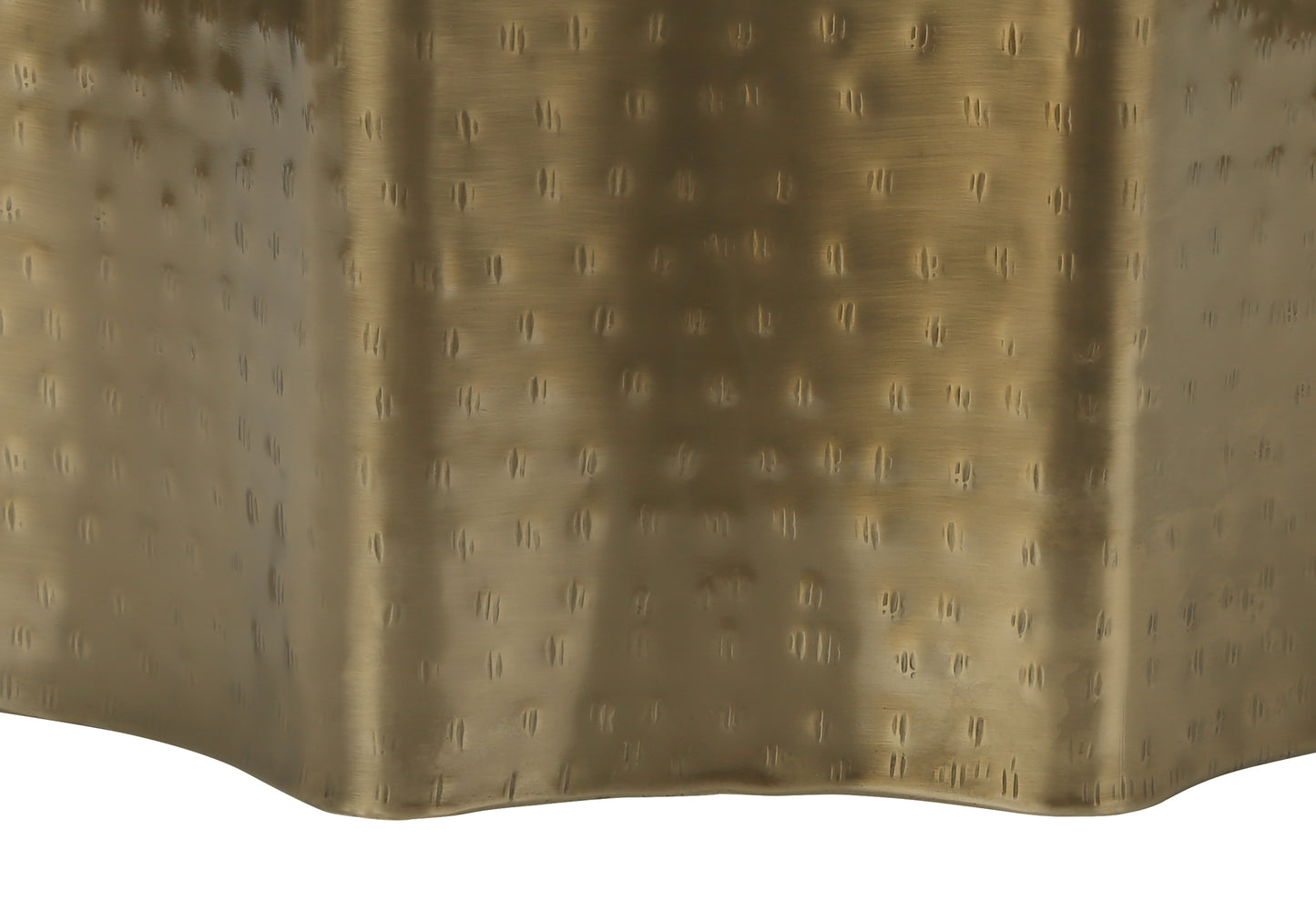 Hammered brass side table base with a textured metallic finish
