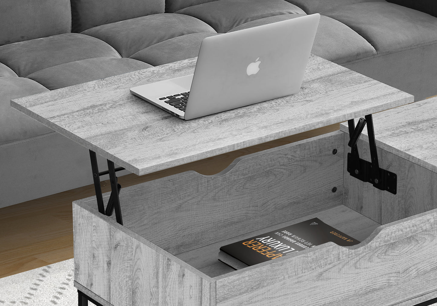 Lift top coffee table in light gray wood grain finish with storage compartment