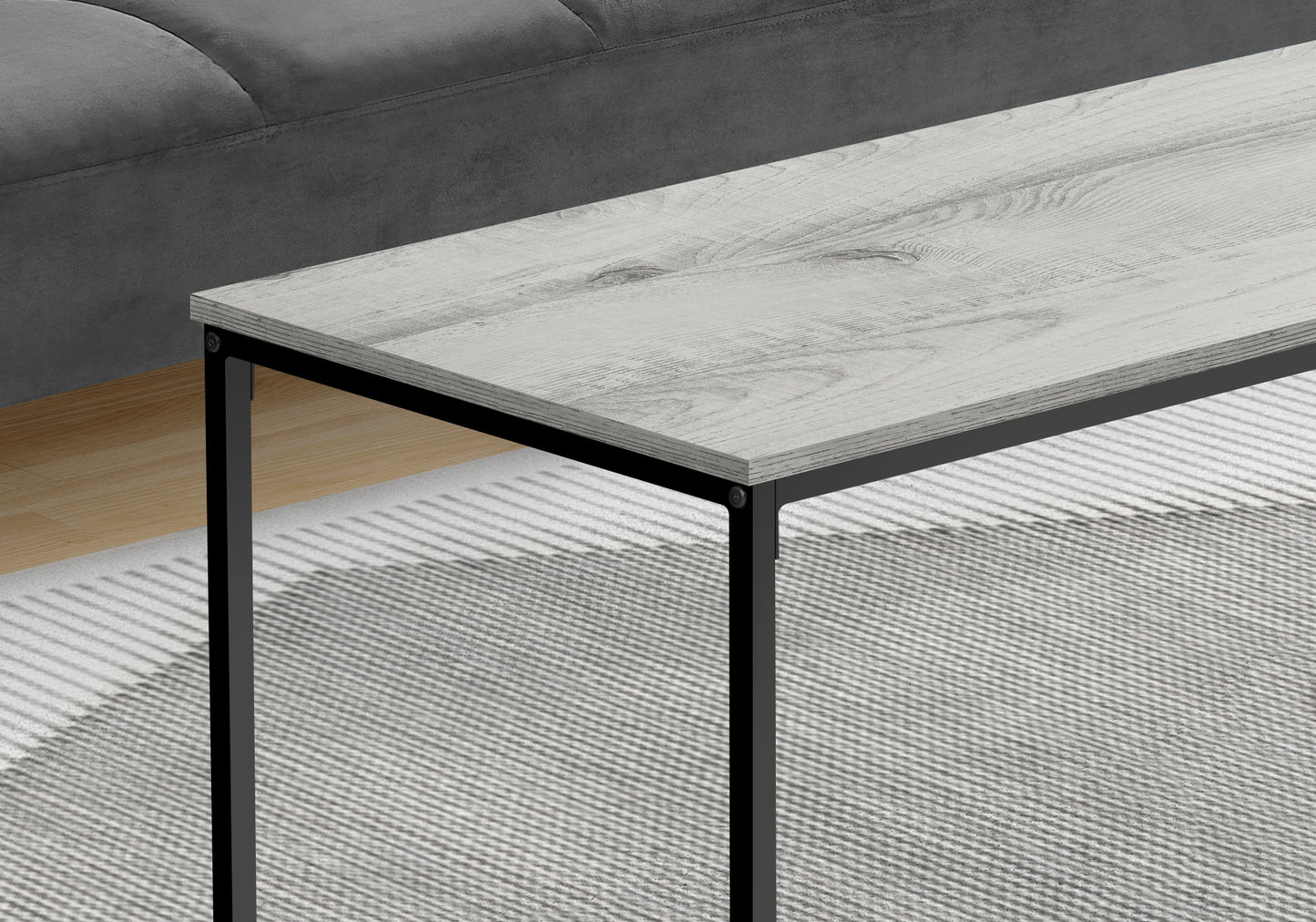 Modern grey wood grain coffee table with black metal legs
