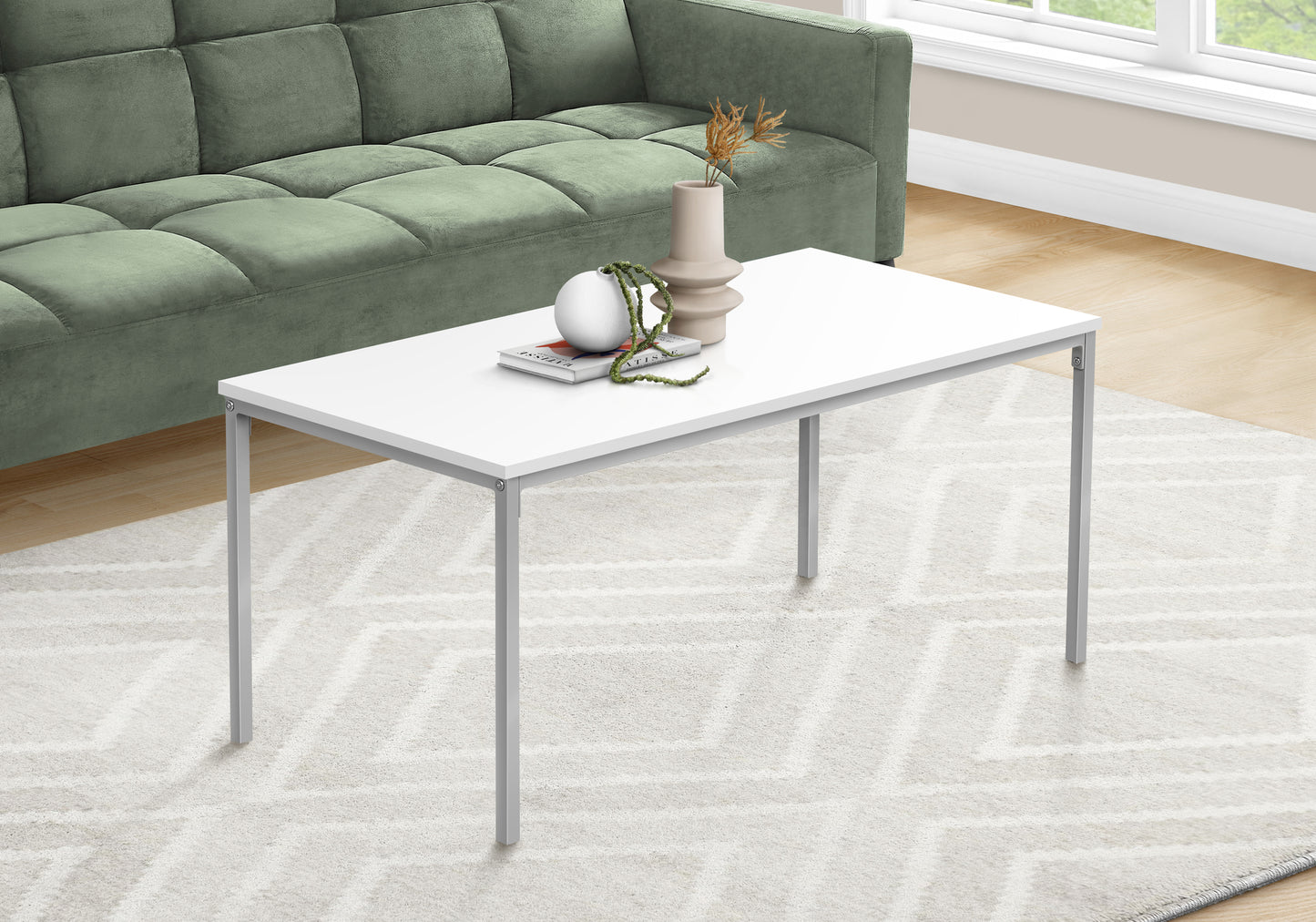 White rectangular coffee table with silver metal legs perfect for modern living rooms