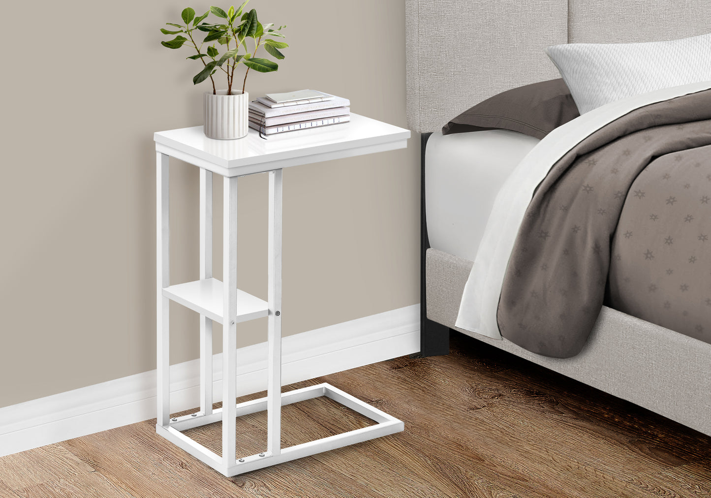 Sleek white ctable with a modern metal frame perfect for bedside convenience