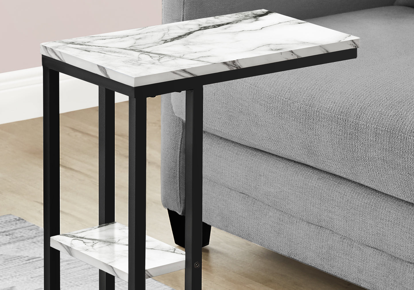 Compact marble Ctable with black metal frame perfect for small spaces