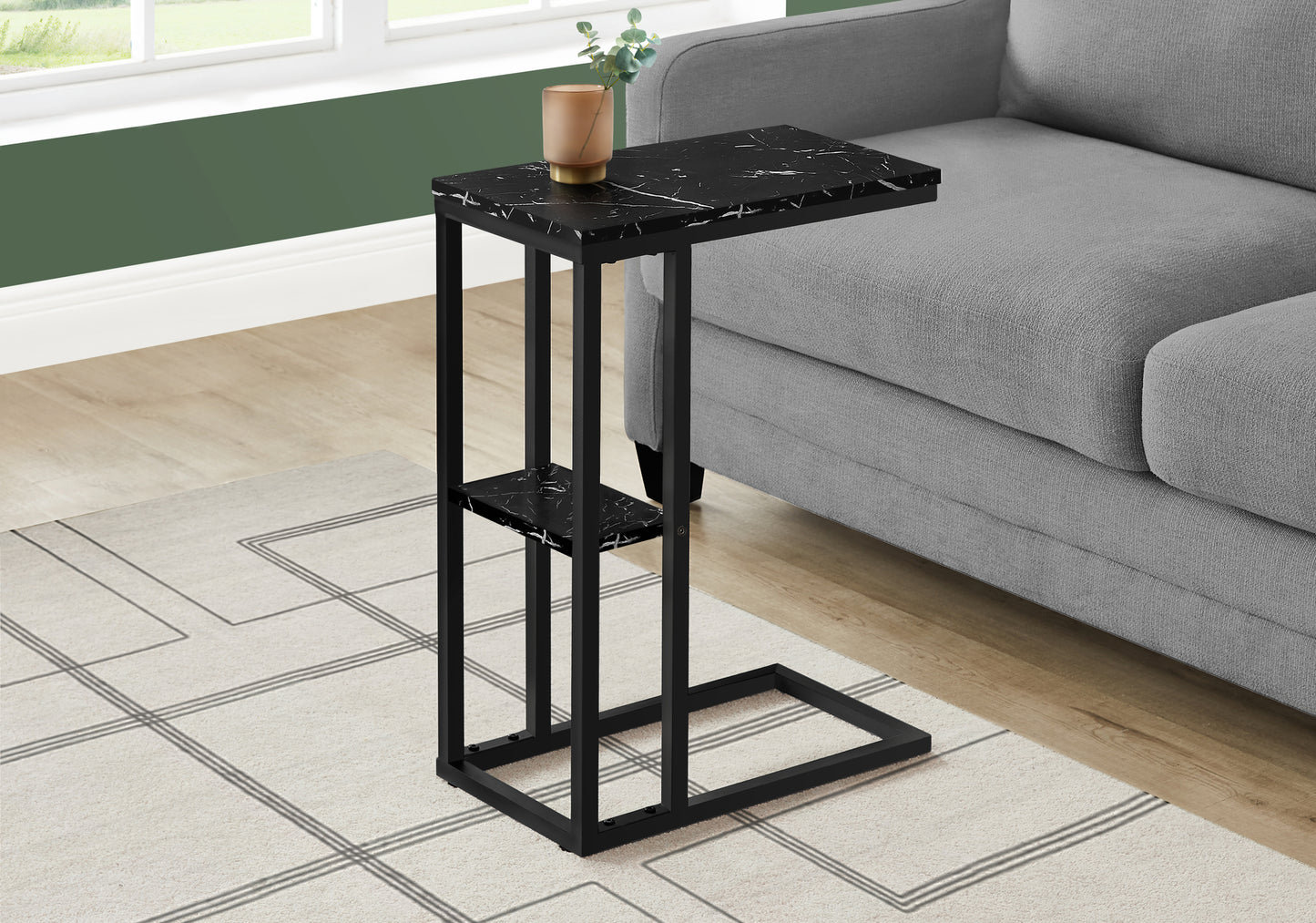 Black marble ctable with a metal frame perfect for beside a sofa