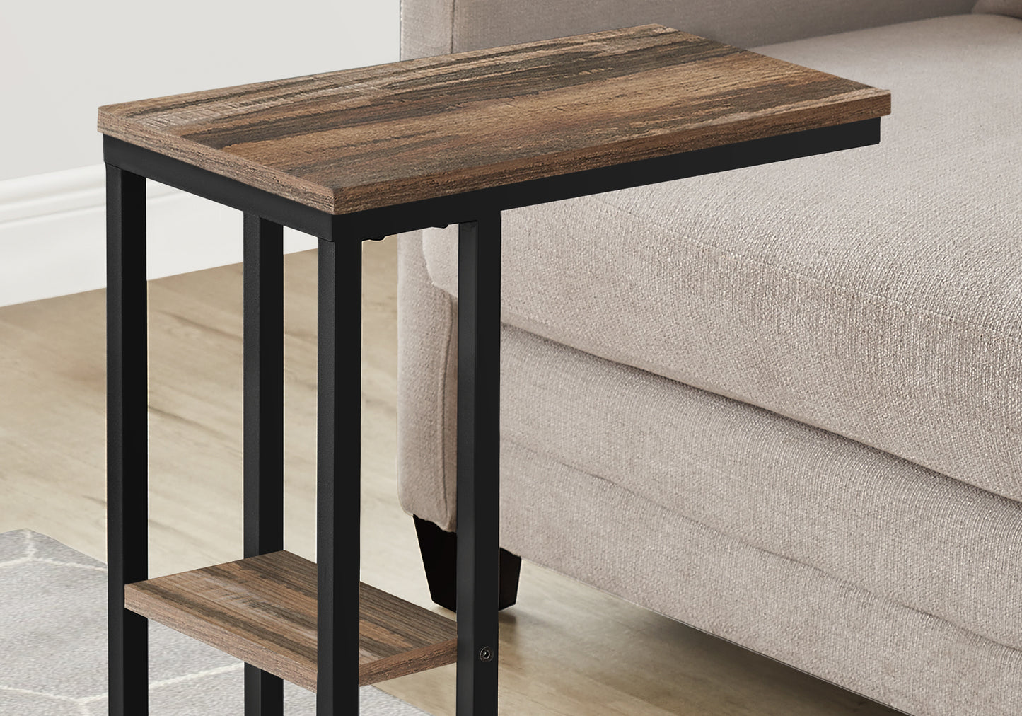 Rustic wood and black metal end table with a cshaped base for sofa use