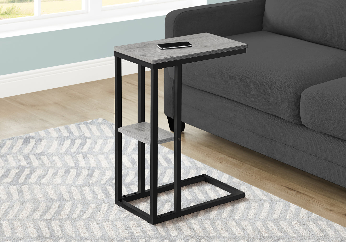 Gray washed wood and black metal Ctable with smartphone on top ideal for sofa use