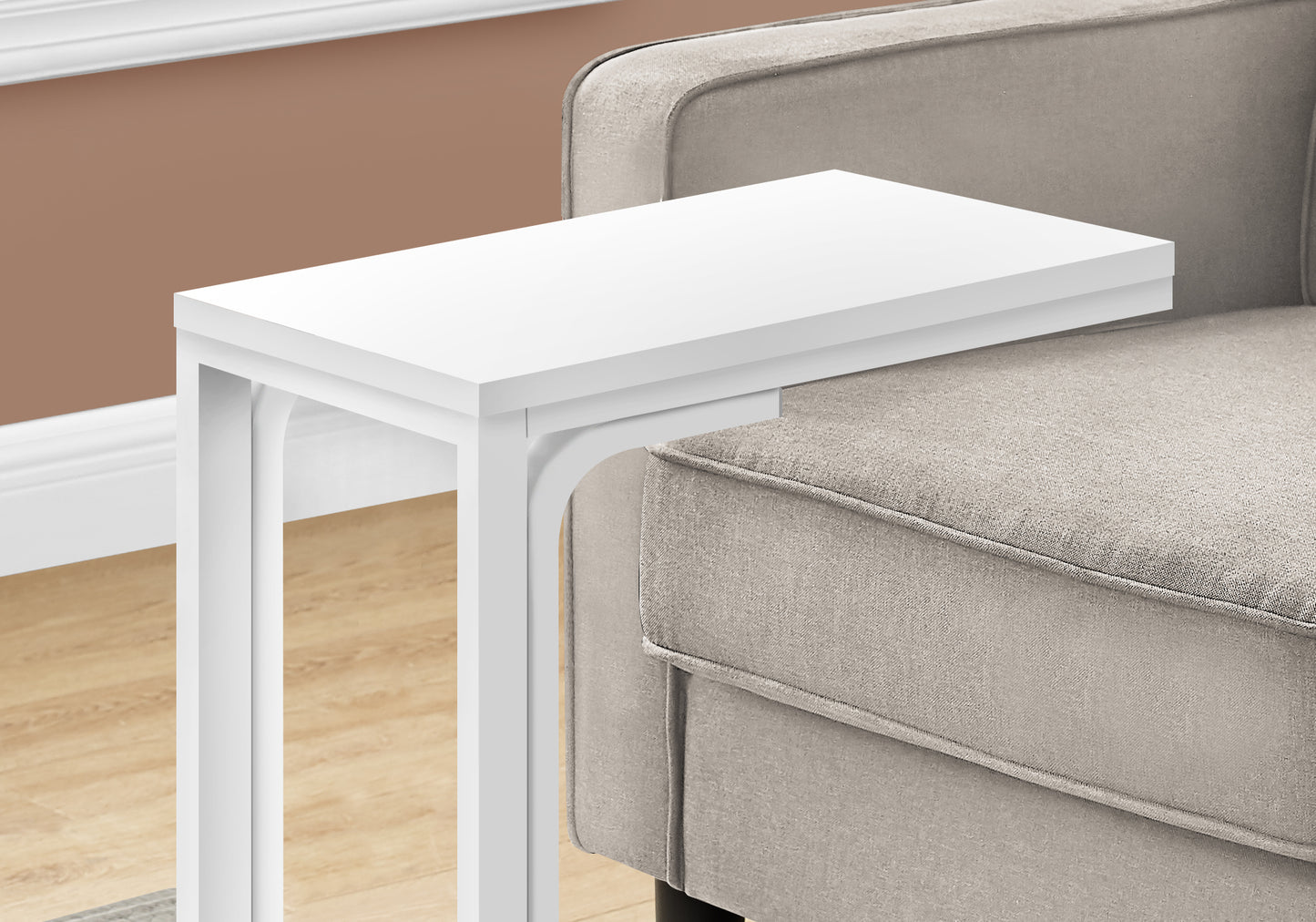 Sleek white Ctable slides easily under sofa for convenient laptop use