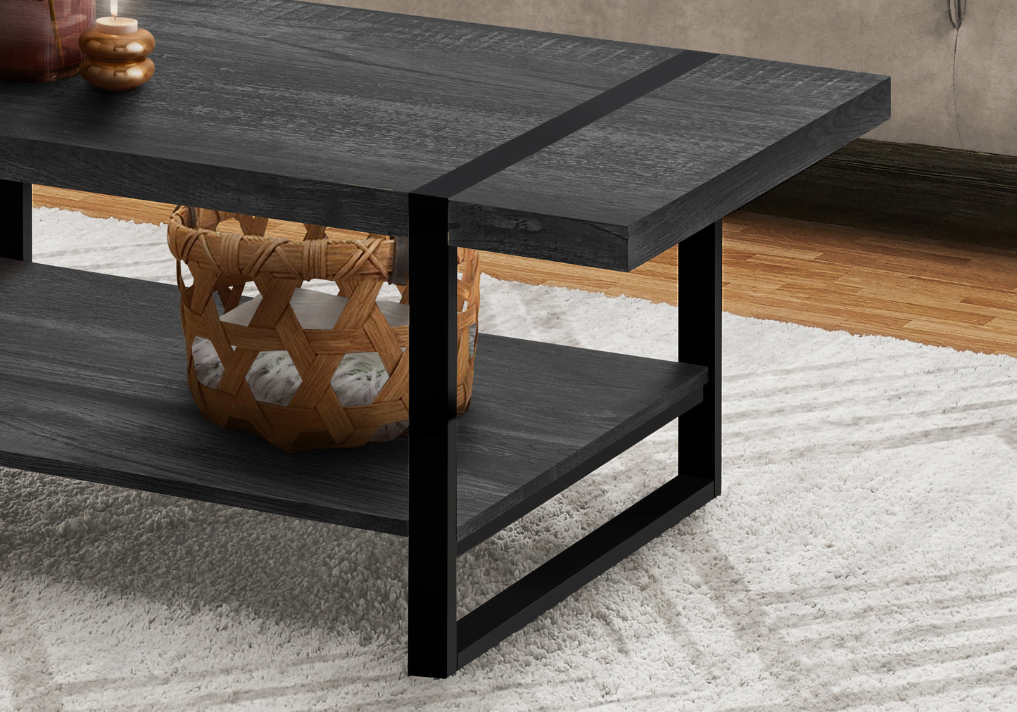 Dark grey wooden coffee table with black metal frame and lower shelf