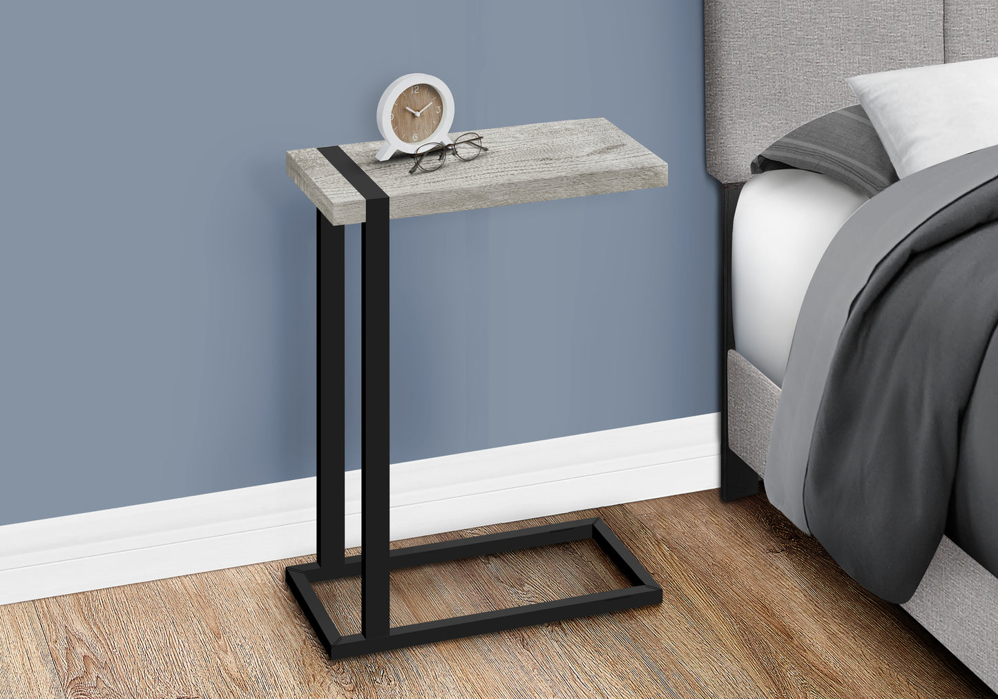 Cshaped side table with distressed wood finish and black metal frame perfect for living rooms