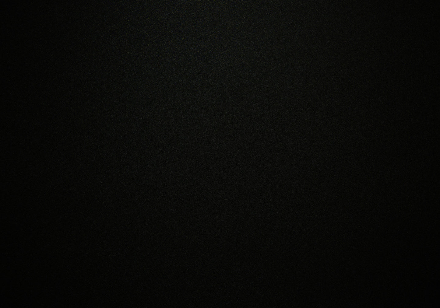 Solid black textured background for product display creating a sleek and modern aesthetic