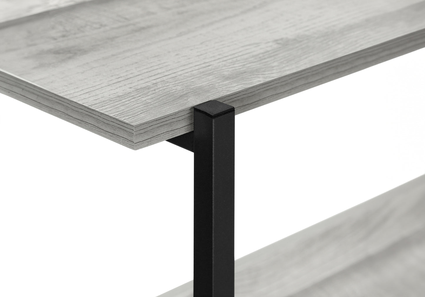 Closeup of a rustic grey wood shelf with black metal support leg