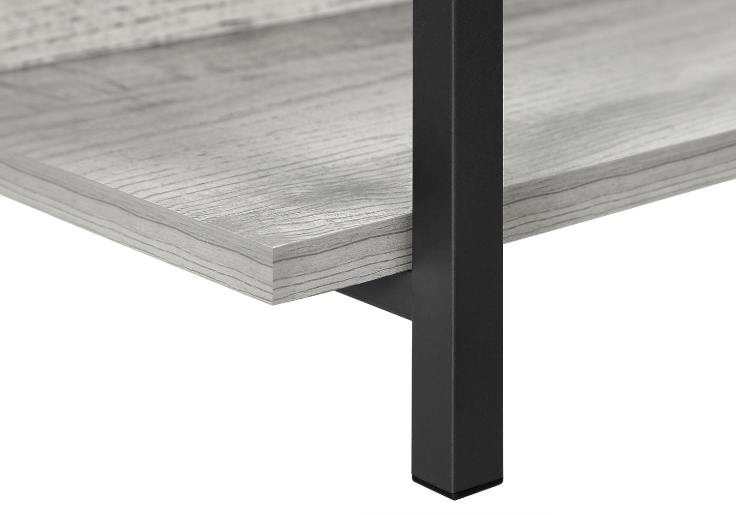 Closeup of a gray wood grain shelf with black metal legs part of a modern furniture piece