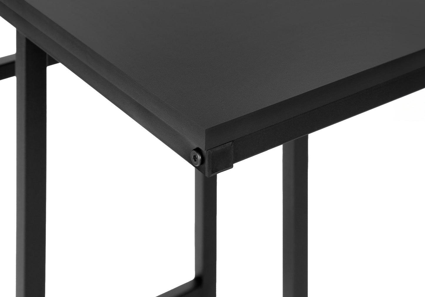 Close up of black metal desk frame with screw detail