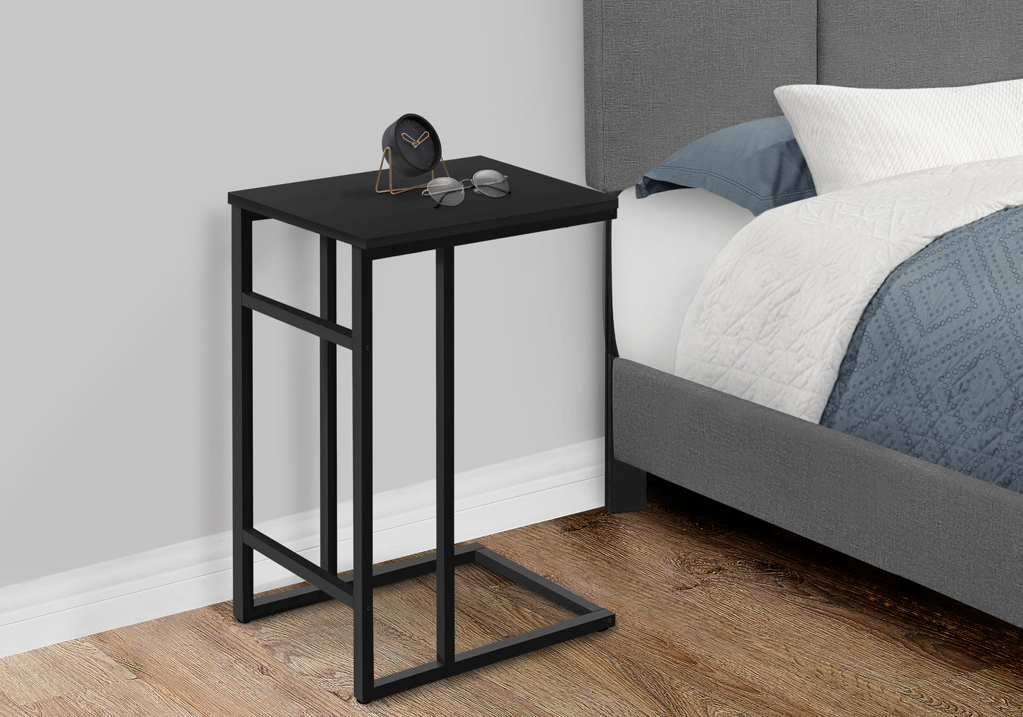 Sleek black ctable with metal frame perfect for bedside use