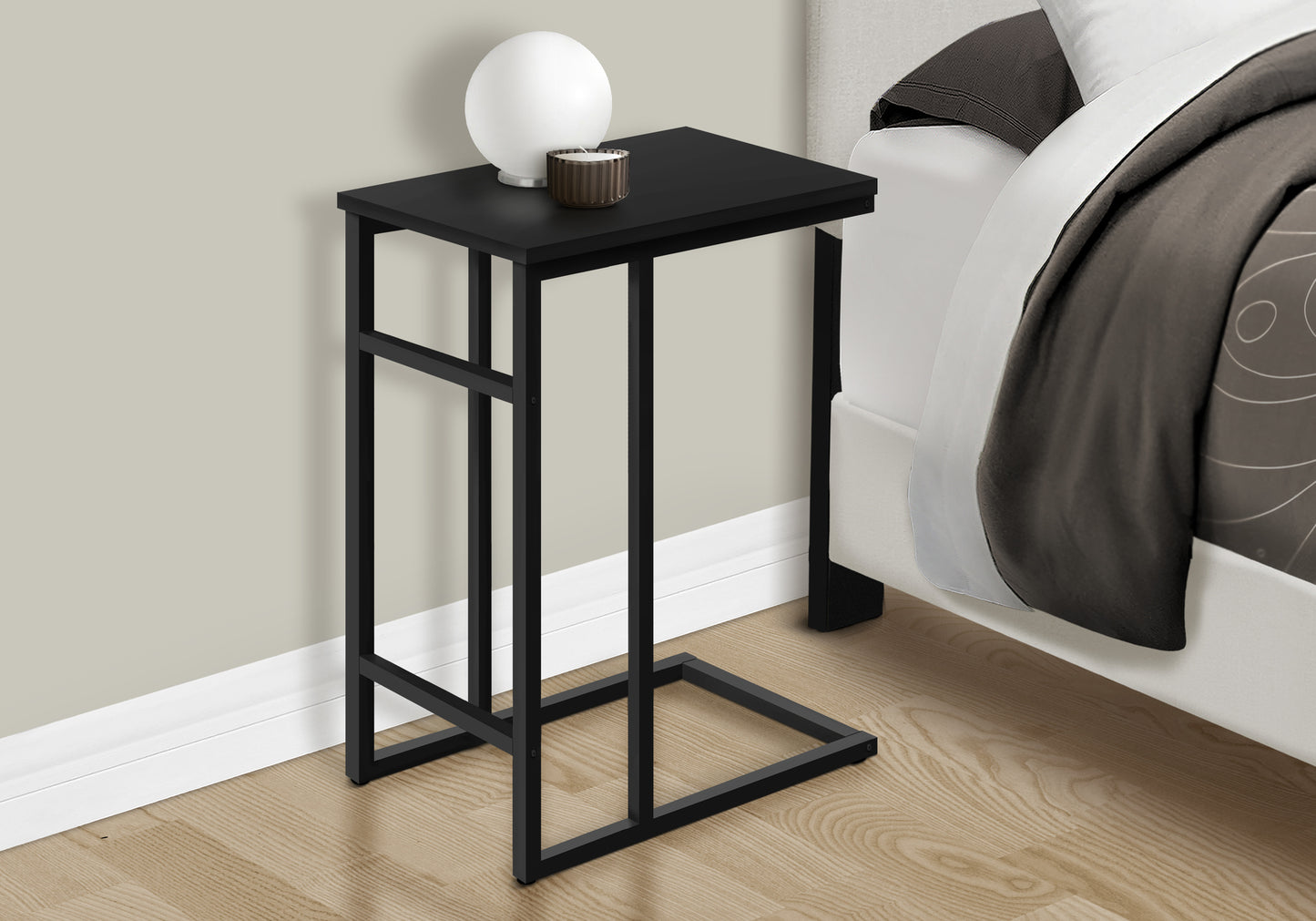 Black Cshaped end table with metal frame perfect for small spaces
