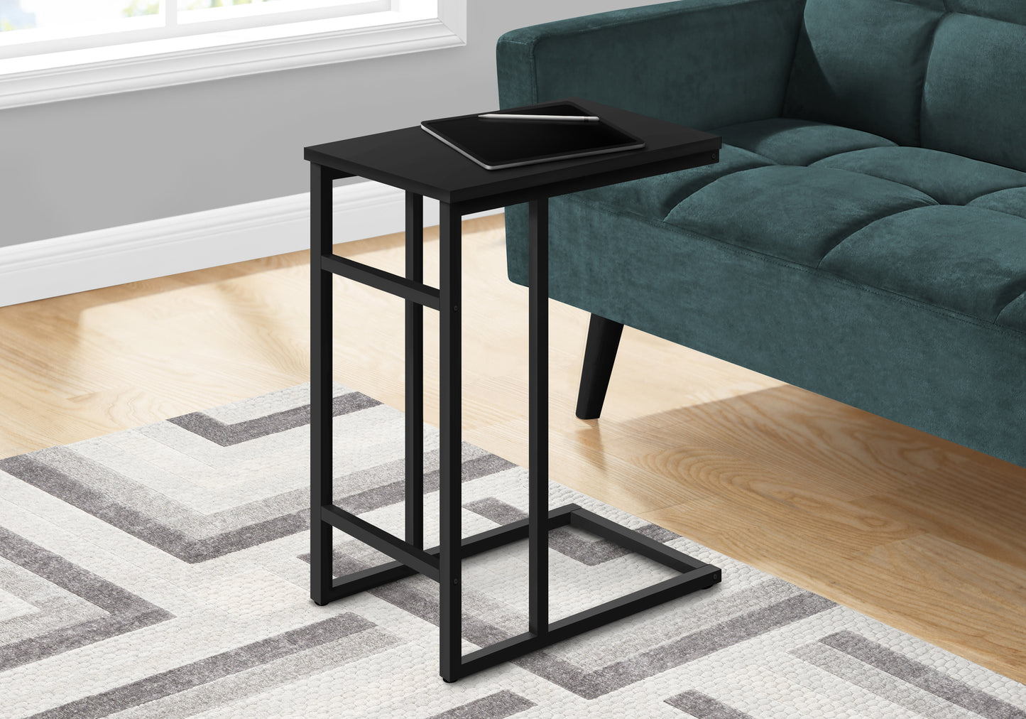 Sleek black metal Ctable with tablet and stylus perfect for small living spaces